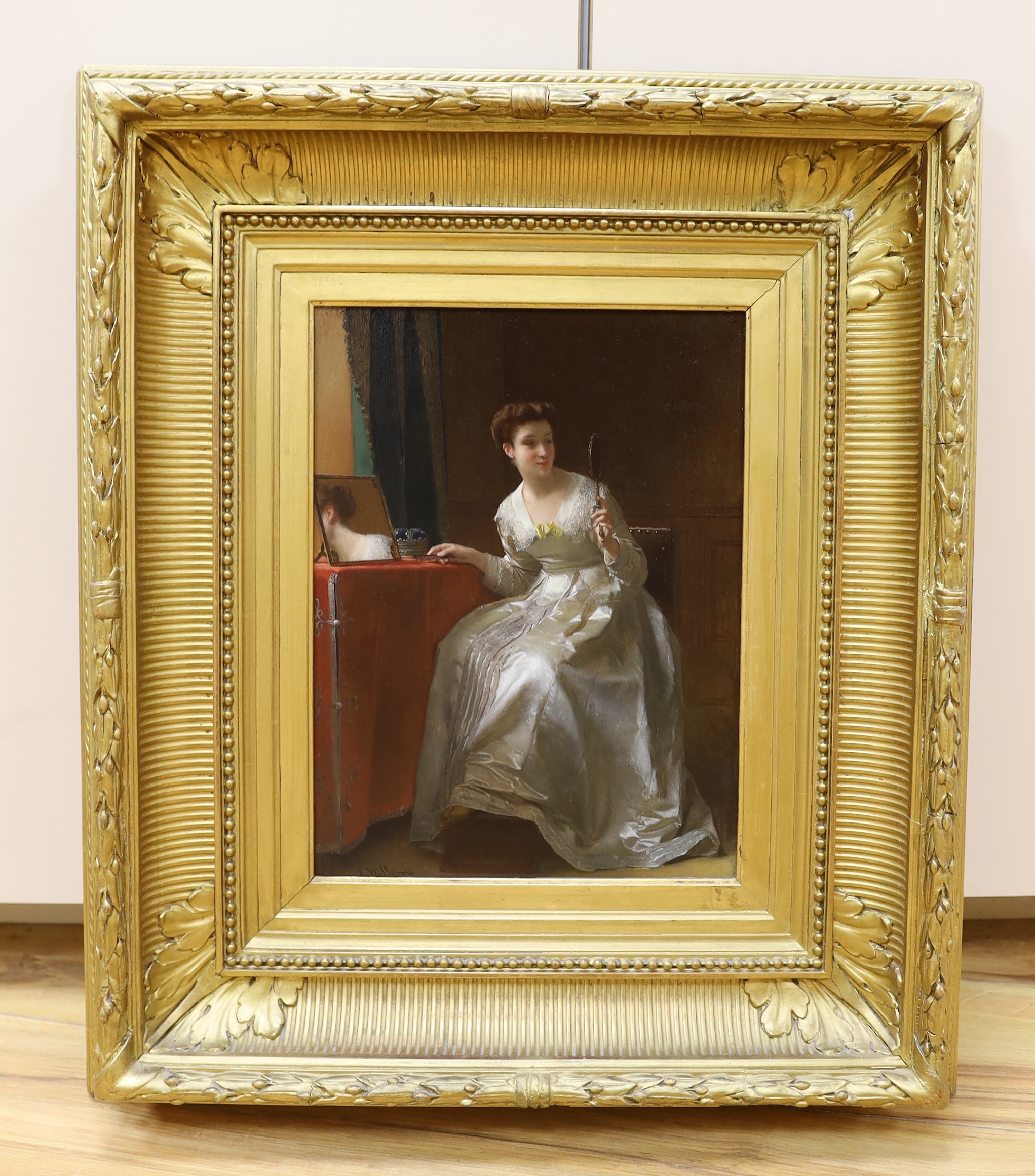 Florent Williams (Belgian, 1823-1905), oil on panel, Lady seated at a dressing table, signed, 32 x 23cm, ornate gilt frame